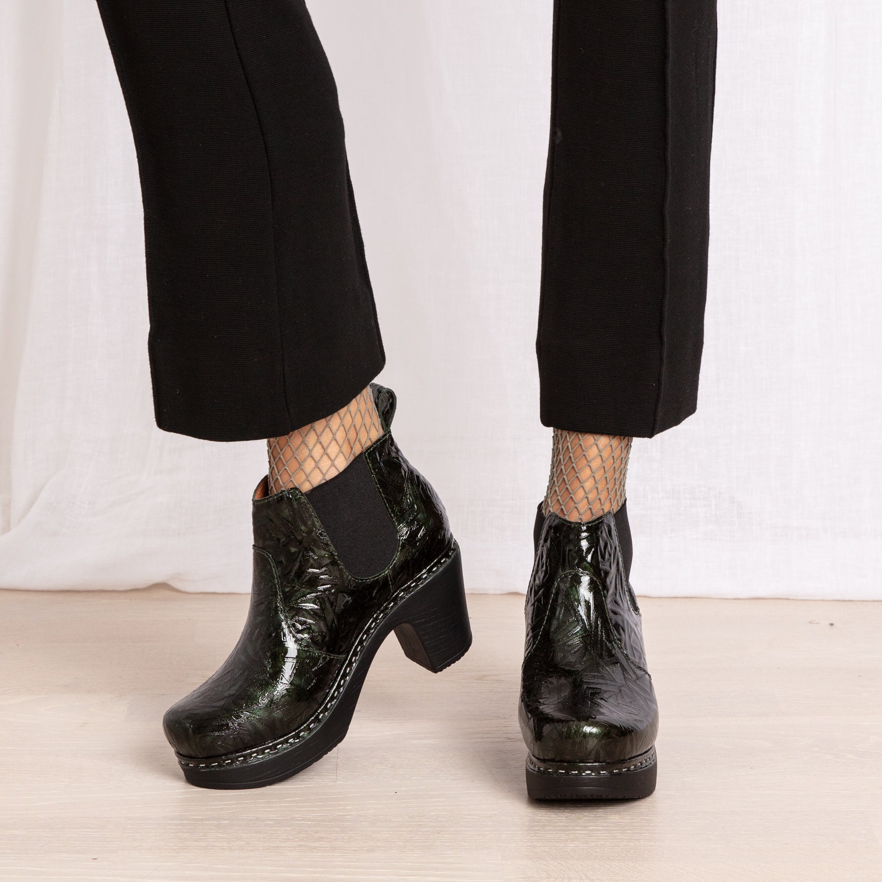Doris green leather patent leather clog boots on model Calou