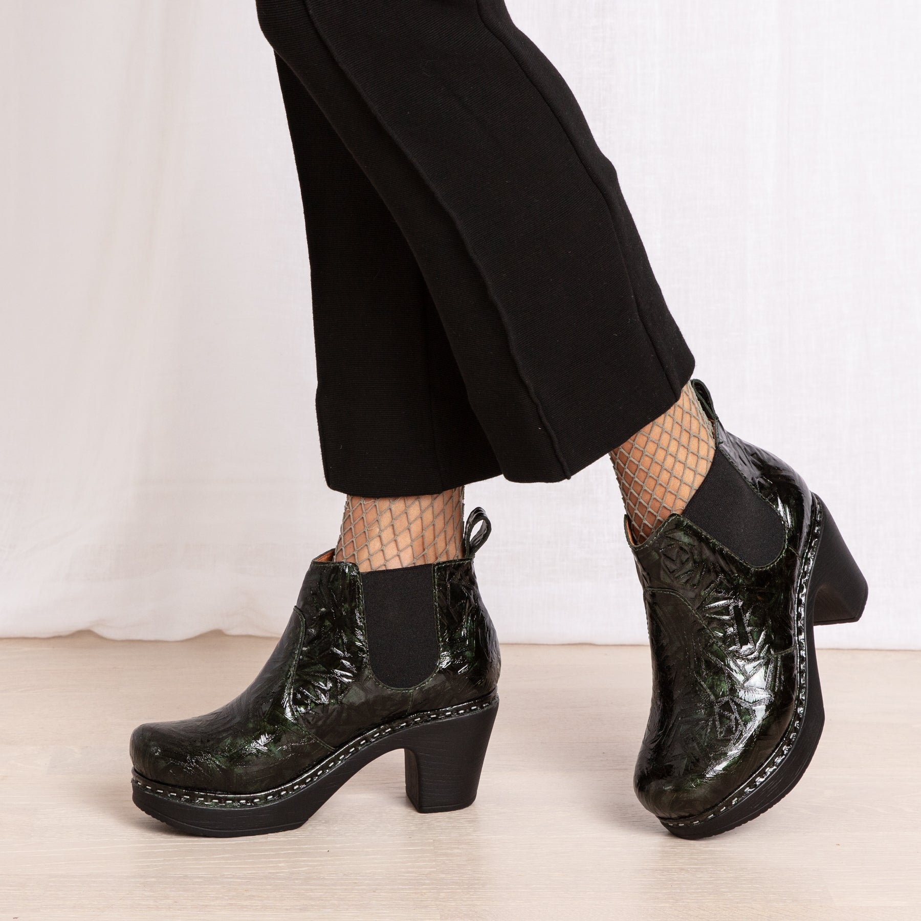 Doris green patent leather clog boots on model Calou