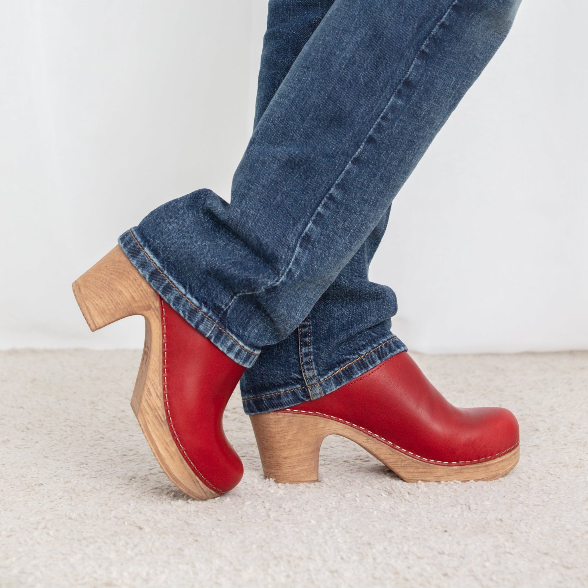 Lisa red clog on model blue jeans Calou
