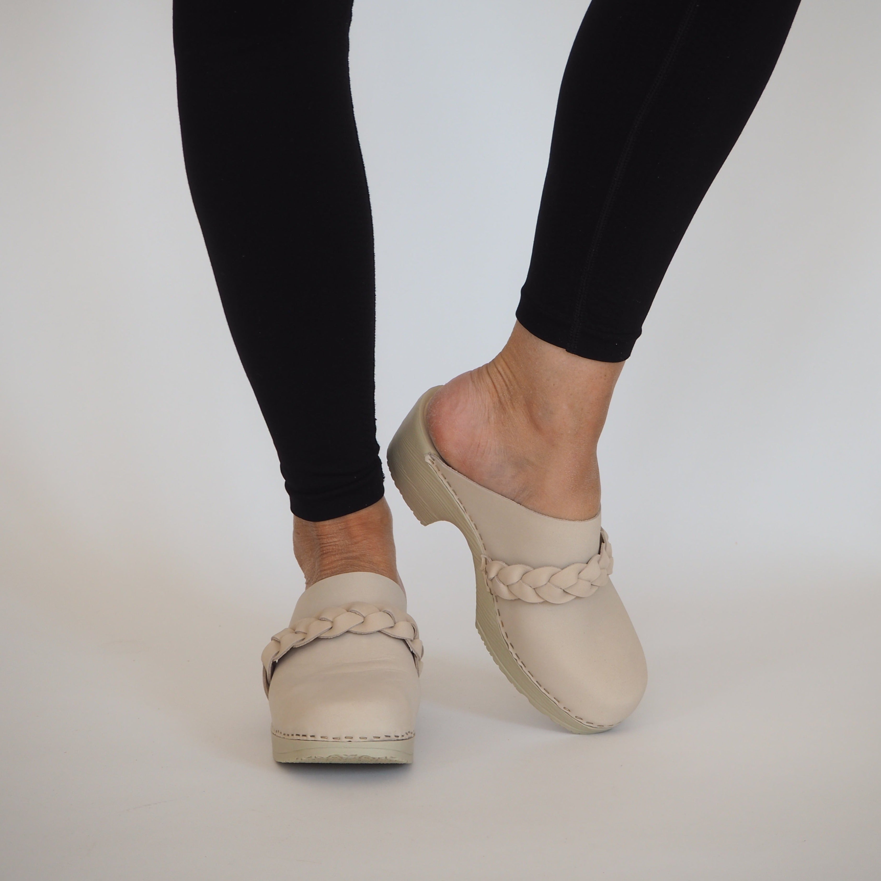 Lotta beige nubuk clogs on model, Calou Stockholm