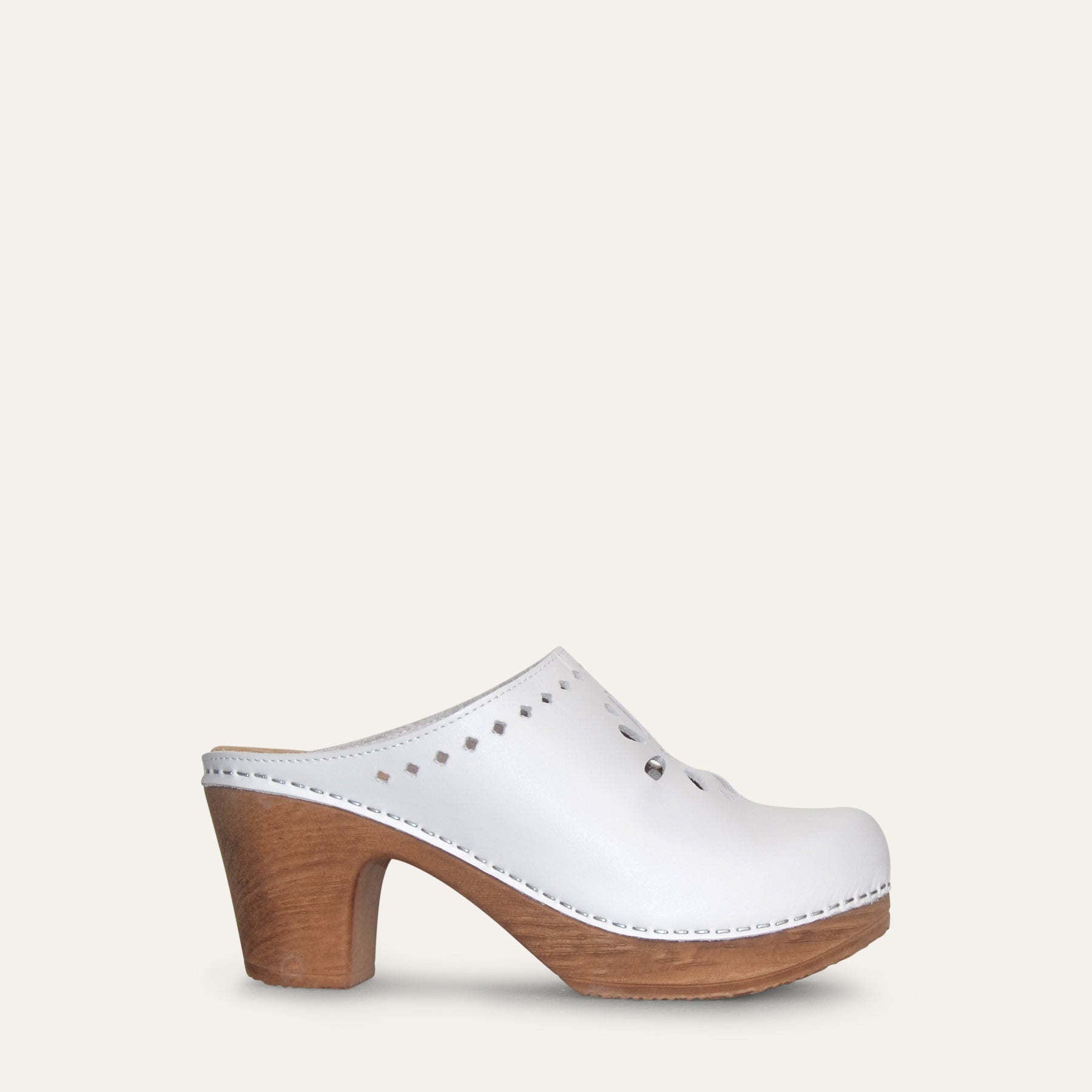 Sideview white clog with ut out details by Calou
