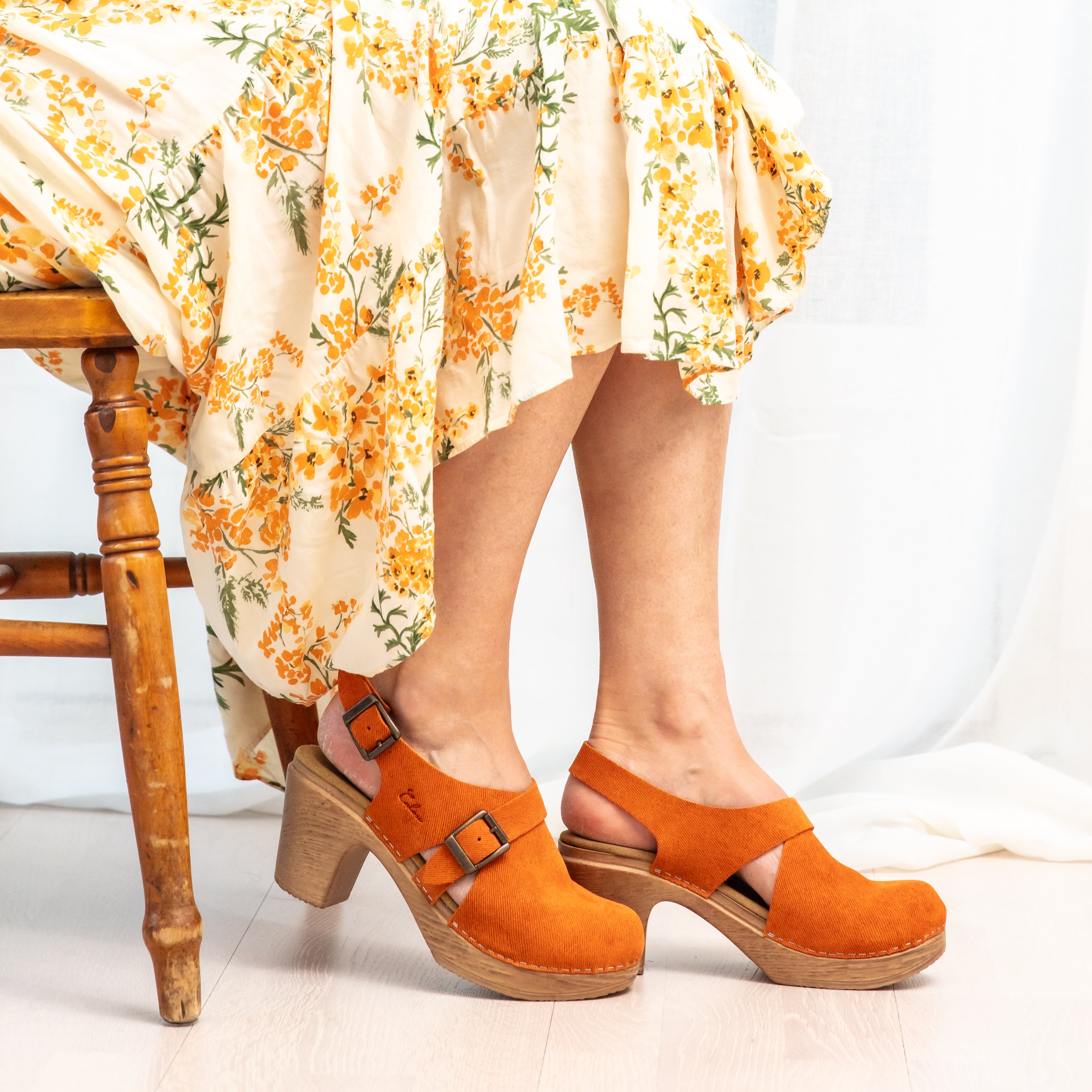 Astrid orange leather clog on model calou