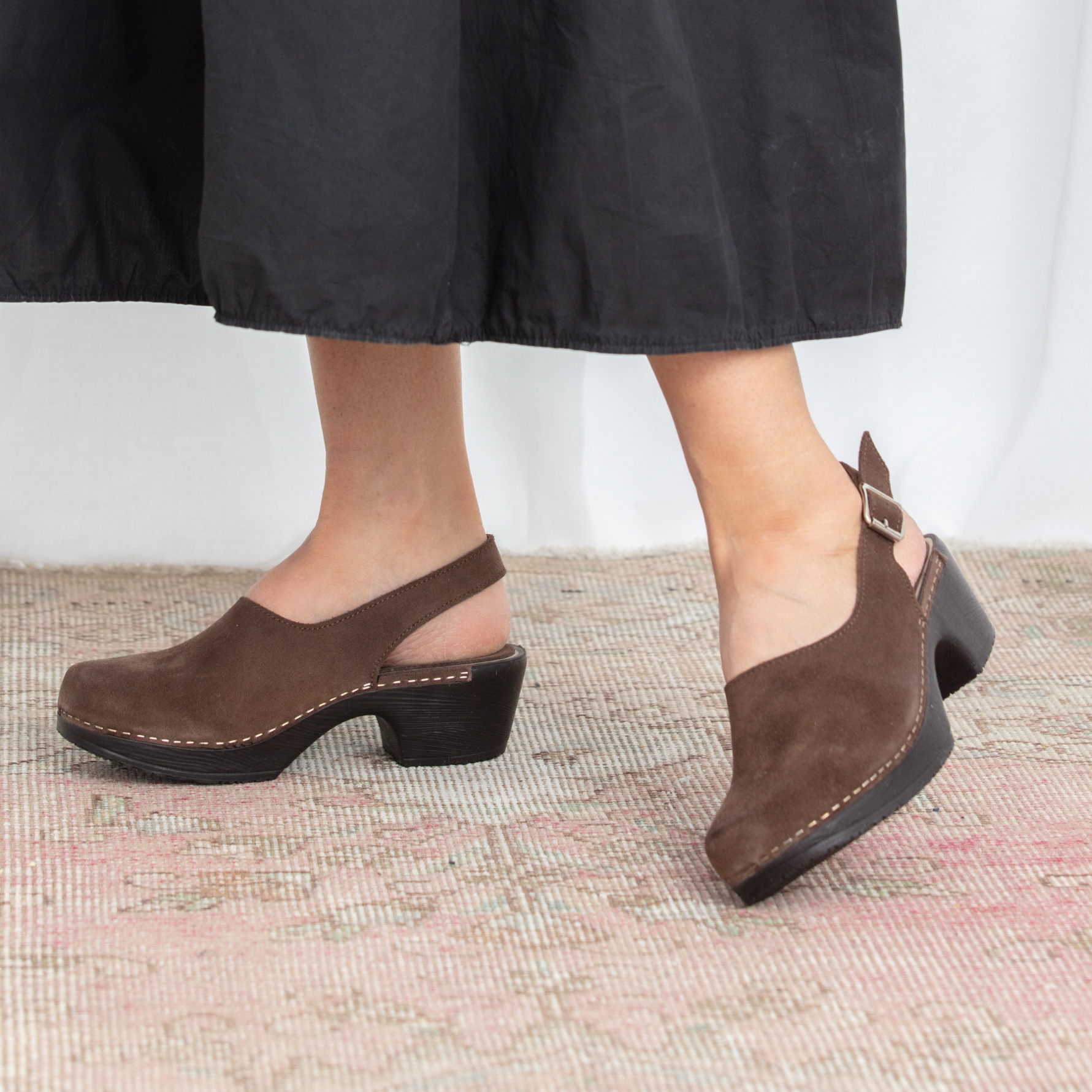 Lilja brown suede slingback clogs on model Calou Stockholm