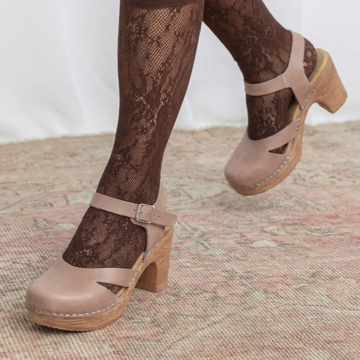 Calou Penny clogs worn with brown lace tights, lifestyle