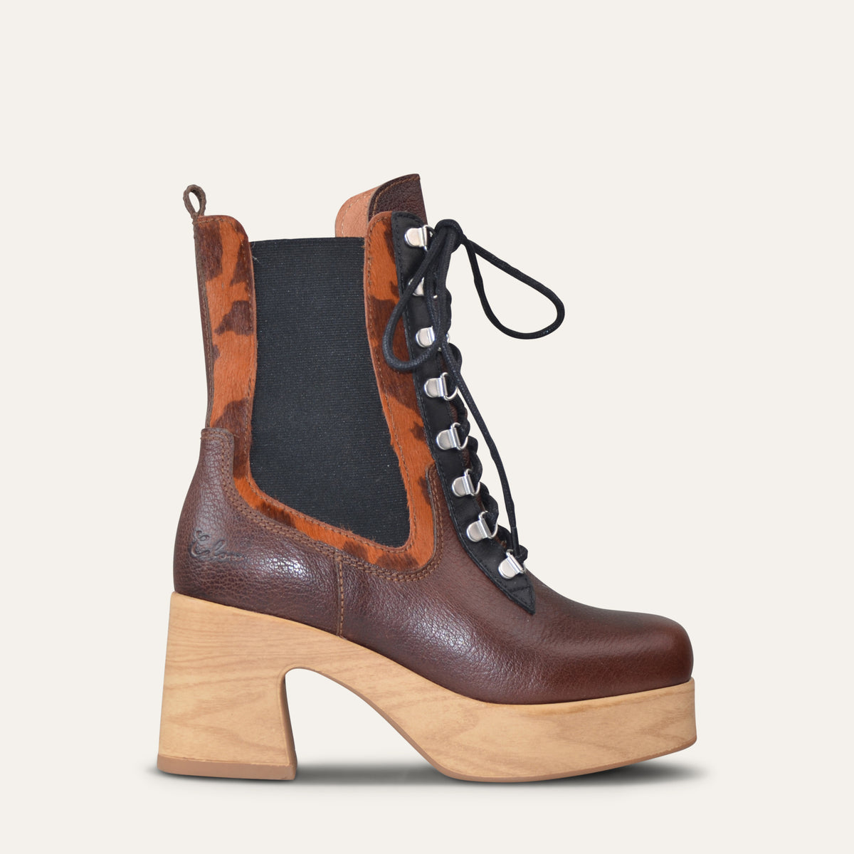 Calou Alba Mix lace-up platform clog boot in brown grained leather with cow print pony hair detail and wooden-look heel, side view
